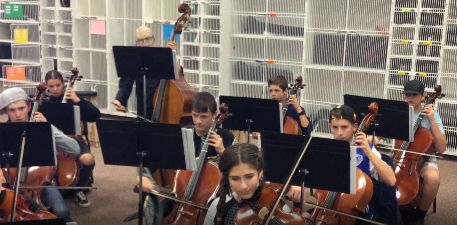 Students performing in orchestra class