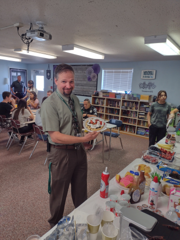 Mr. Mecham, the principal, showing off his breakfast plate