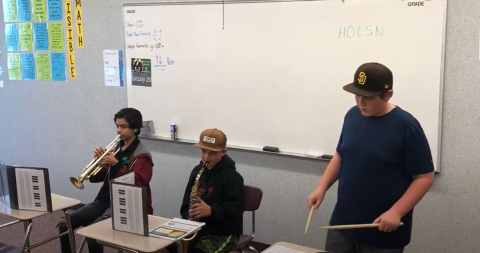 Students playing instruments in math class
