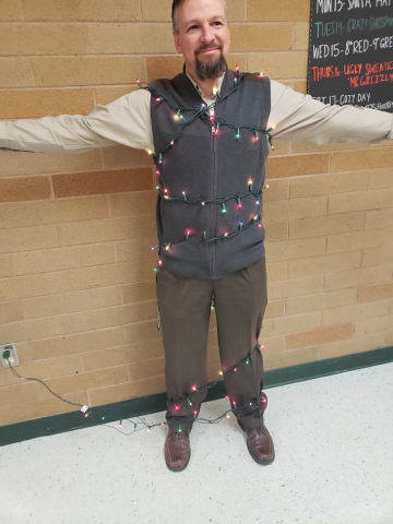 Mr. Mecham, the principal, wearing Christmas tree lights